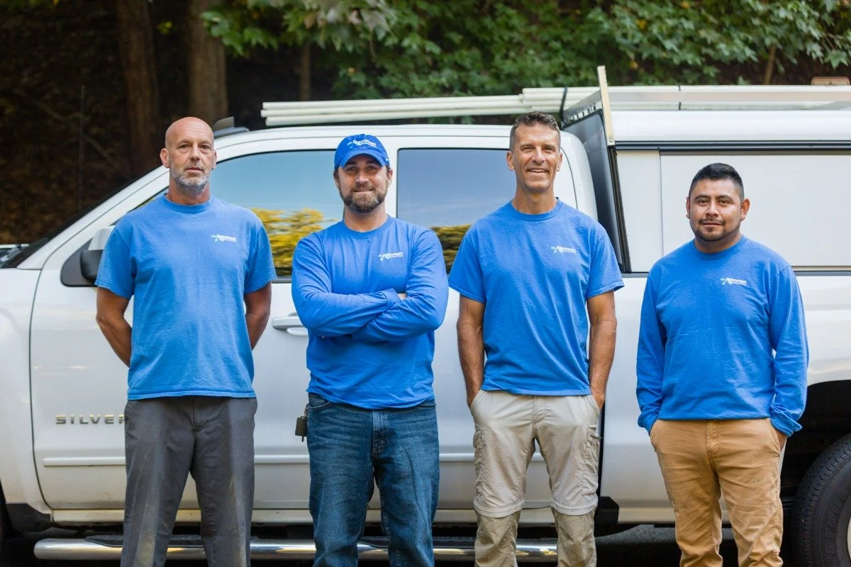 The Rainman Irrigation team beside their work truck